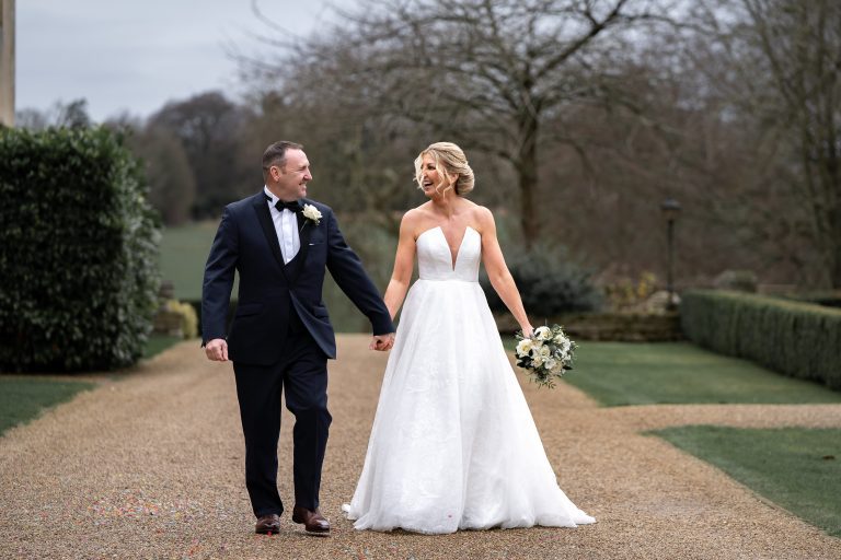 rushton-hall-wedding-bridal-couple-walking-in-grounds