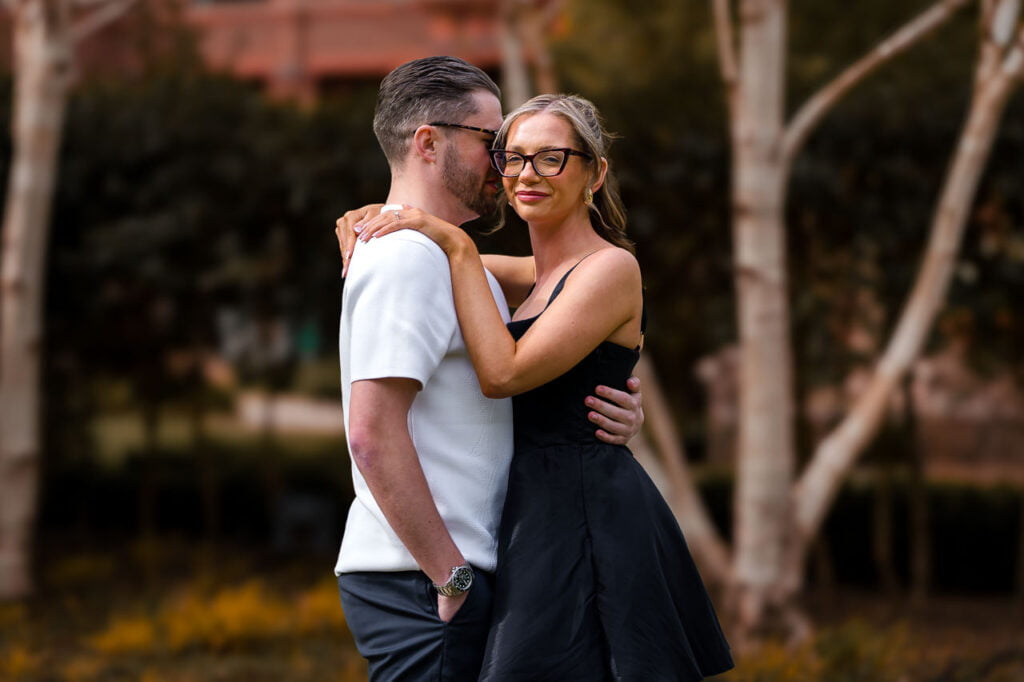 engaged couple in gardens at the grove hotel